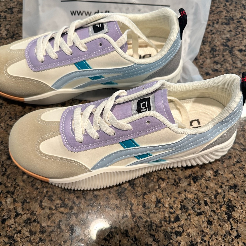 Brand new, never worn. Women’s DeFlorance sneakers-Size 10-10.5. Bottom says 42